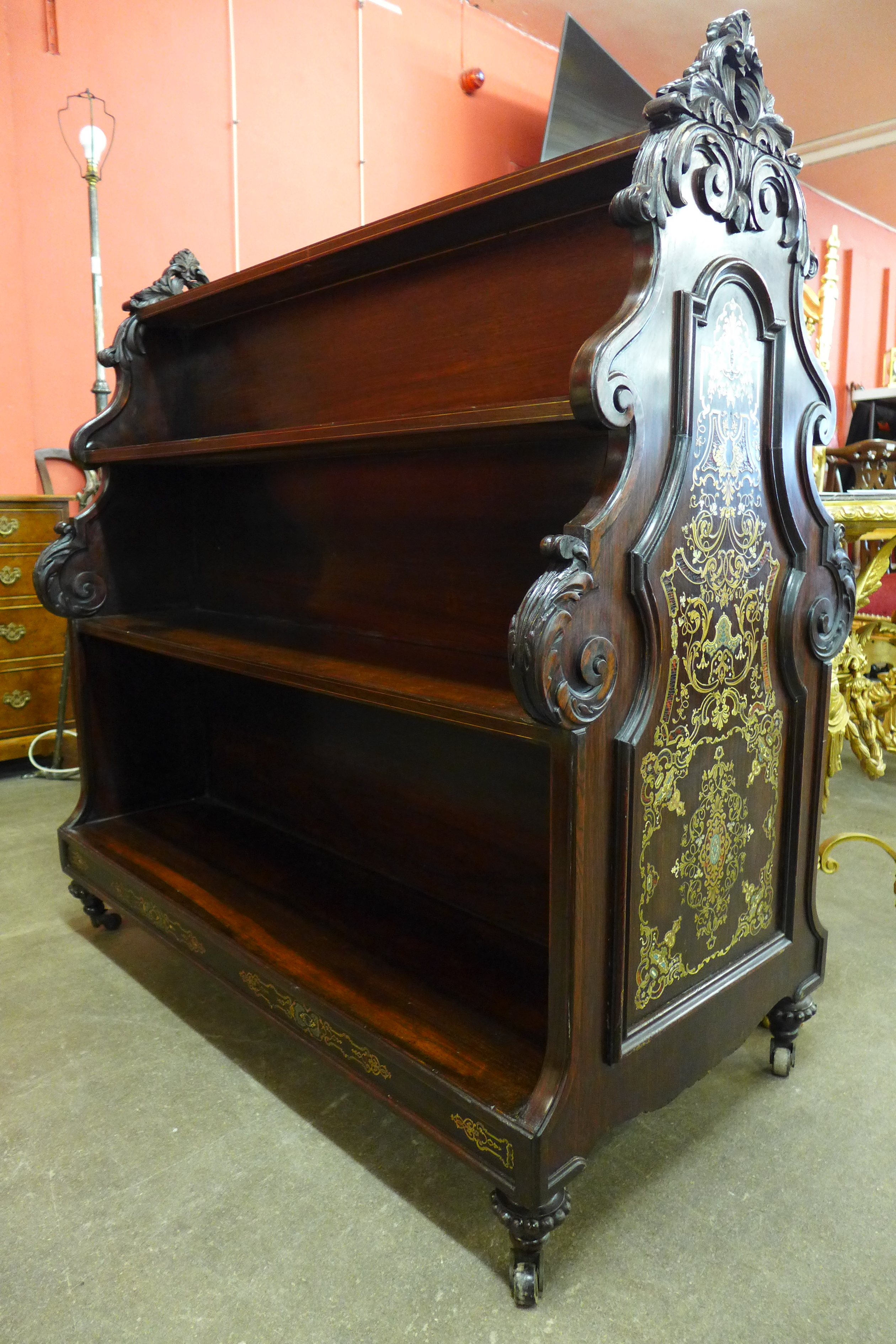 An early Victorian inlaid rosewood double sided bookcase