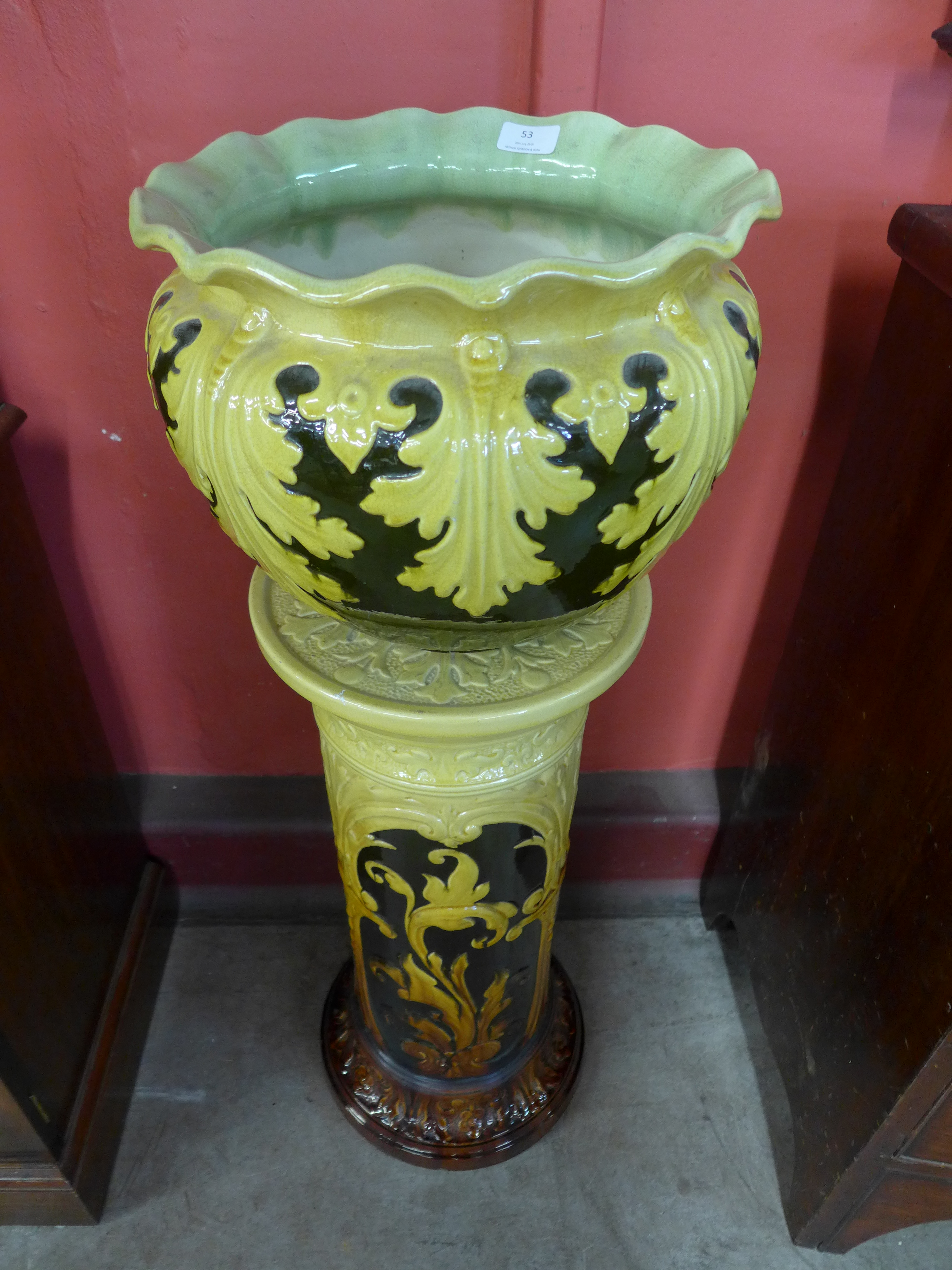 A Leeds Art Pottery jardiniere and stand