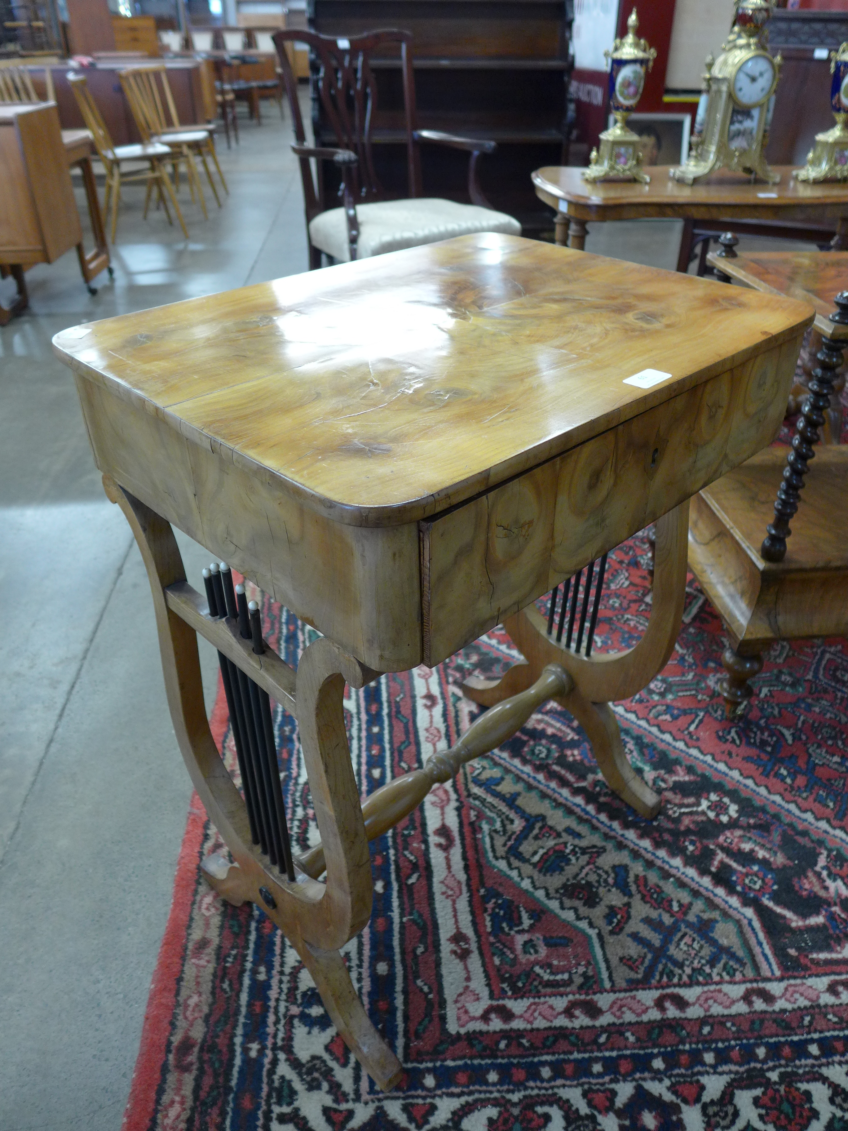 A Victorian walnut sewing table