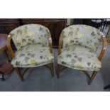 A pair of Art Deco walnut and upholstered tub chairs