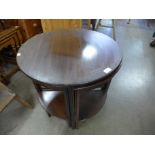 A mahogany circular nest of tables