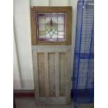 A pine and stained glass door