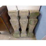 A set of three stone balustrades