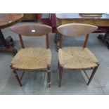A pair of Danish Peter Hvidt teak chairs
