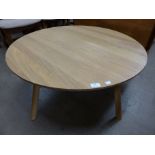 An Ercol style circular coffee table