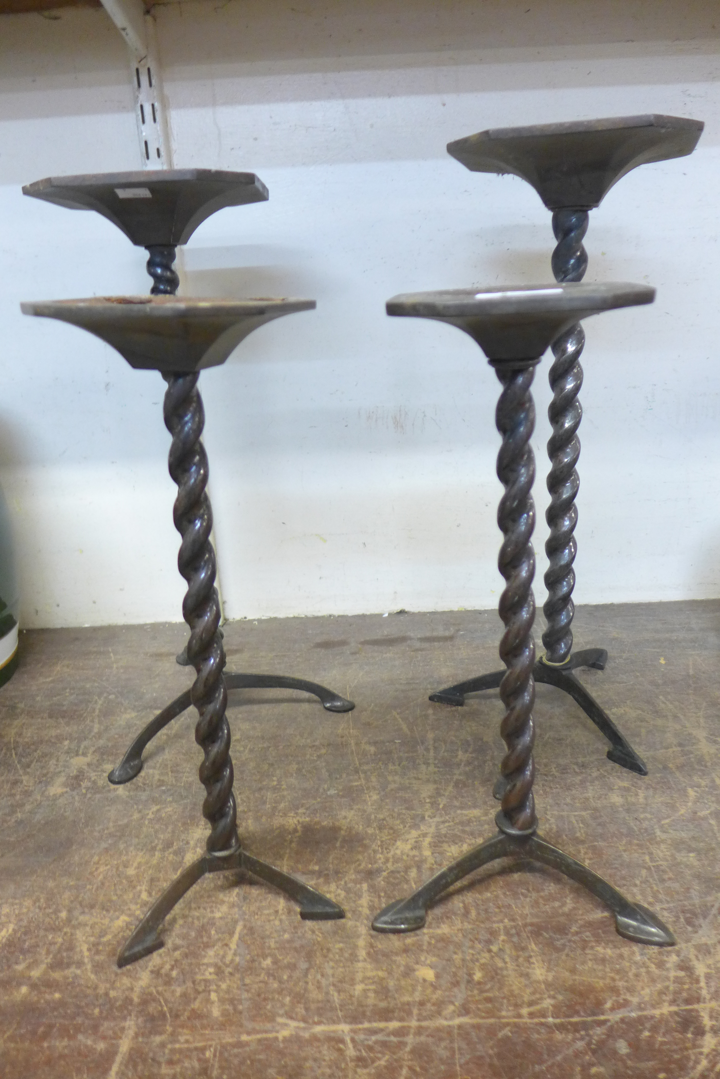 A set of four early 20th Century steel barleytwist shop display stands