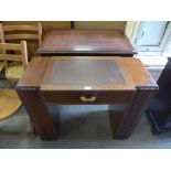 A mahogany writing table and an Art Deco walnut kneehole desk