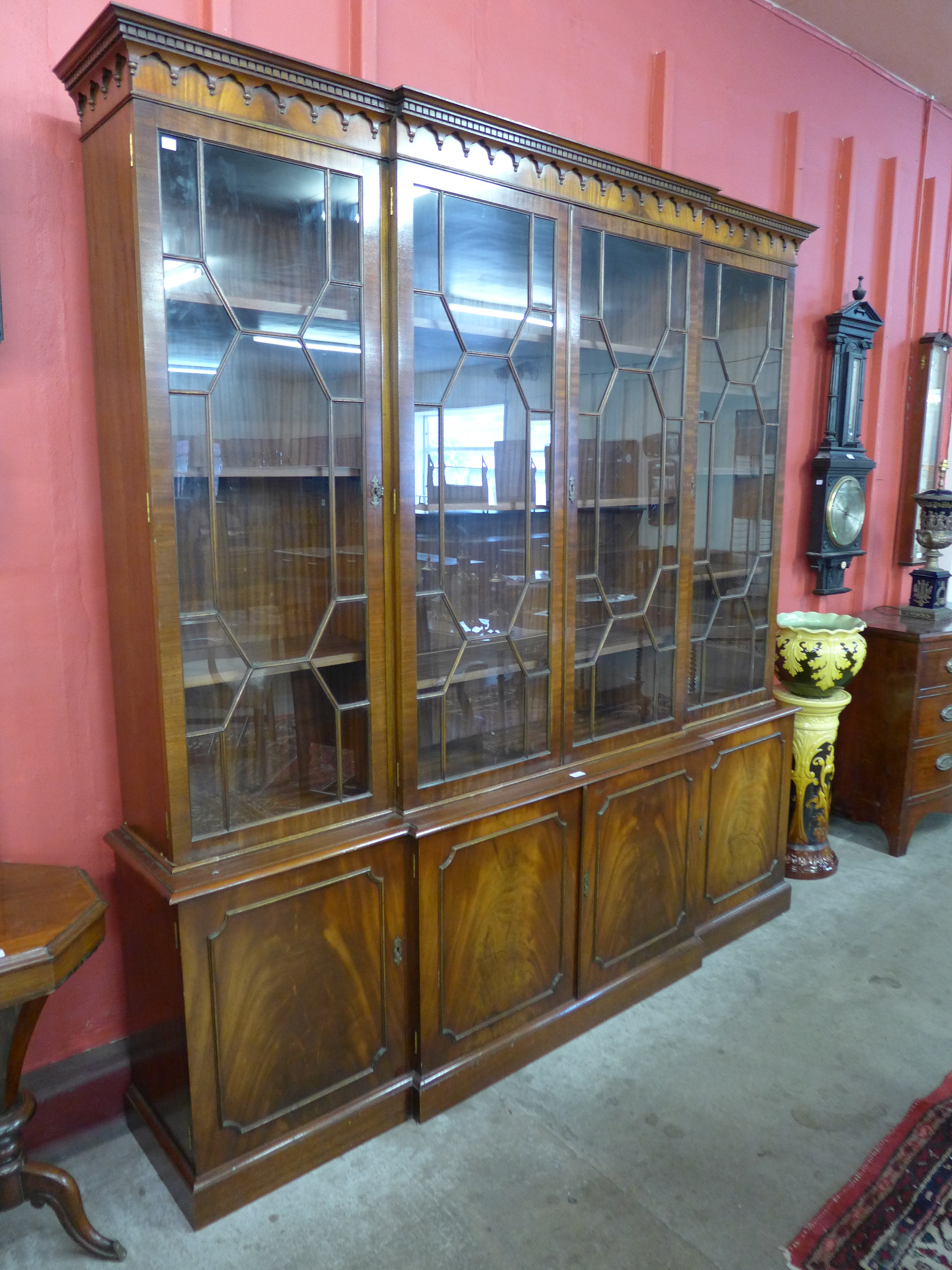 A mahogany four door breakfront bookcase