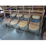 An oak folding four seat chapel bench