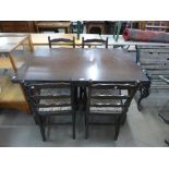 An oak draw leaf dining table and four chairs