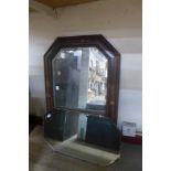 An oak octagonal framed mirror and one other