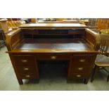 A Victorian walnut tambour roll top desk