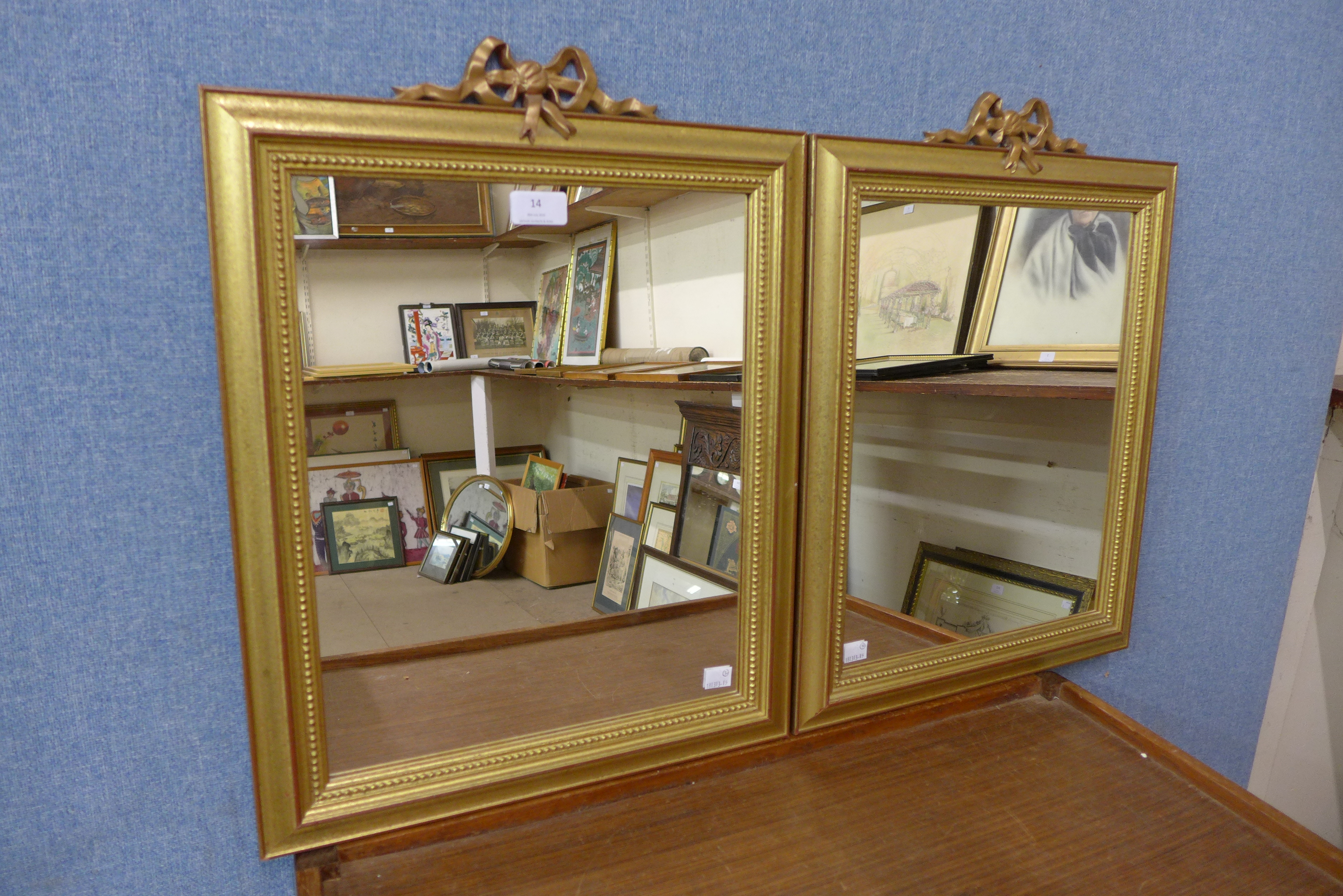 A pair of gilt framed mirrors