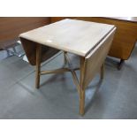 An Ercol drop leaf dining table