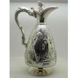 A Walker & Hall silver plated claret jug with embossed decoration