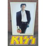 A large Bruce Springsteen record shop promotional board and a Kiss promotional board