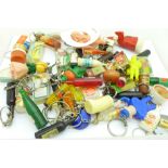 A collection of fifty advertising keyrings