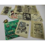 The Beatles A&BC bubblegum cards, a badge, guitar strings and a beetle brooch,