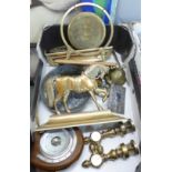 A brass table gong, a pair of brass horse door stops, barometer, desk bell,