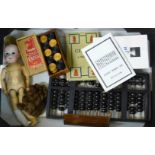 A Chinese abacus with instructions, a set of Staunton chess pieces, draughts, doll,