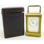 A cased brass and glass carriage clock,