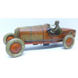 A large pre-war Tipp & Co tin-plate clockwork racing car with original battery-powered light,