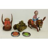 A Haji tin-plate clockwork Donkey Boy, made in Japan, a clockwork tin-plate monkey toy,