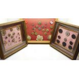 Three framed button displays;