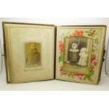 A Victorian photograph album with some Victorian photographs,