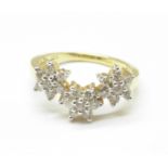 An 18ct gold and diamond triple cluster ring, 4.