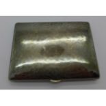 A continental hammered cigarette case, marked 835,
