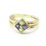 A 9ct gold, peridot and sapphire ring, 2.