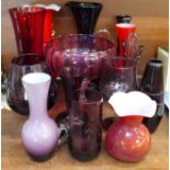 A cranberry glass bowl and other red glass, vases, jug, candlestick, etc.