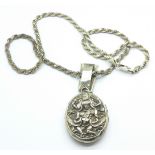 An Indian silver locket on silver chain,