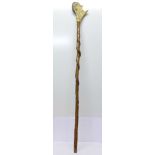 A folk art walking stick/staff