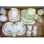 A Delphine china tea set, a Crown China tea set and a Czechoslovakian tea set,
