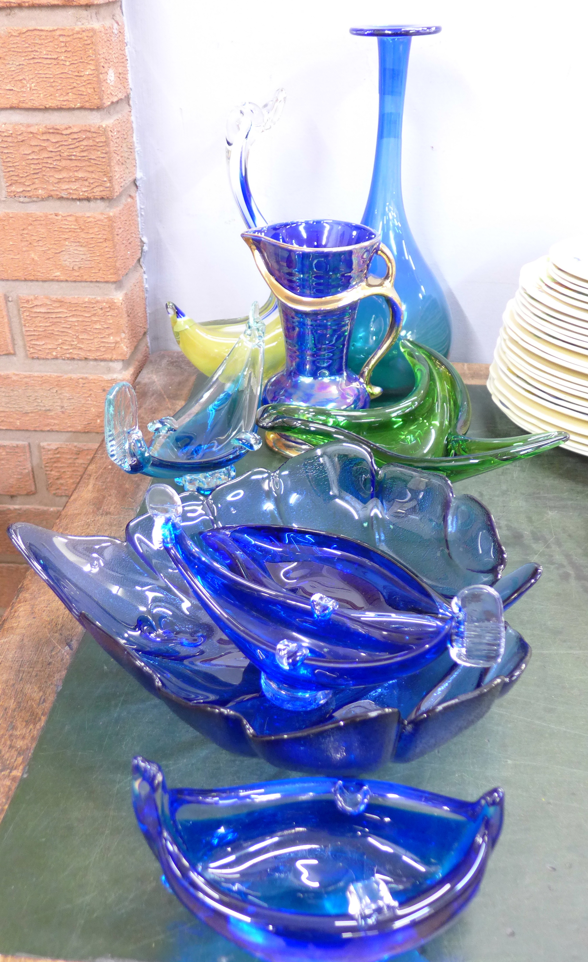Nine items of blue and green glass