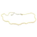 A pearl necklace with 15ct gold and enamel clasp