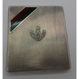 A silver and enamel cigarette case, with The Loyal Regiment military badge,