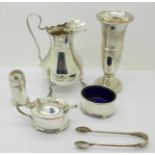 A collection of sterling silver; jug, vase, three piece cruet set and a pair of sugar bowls,