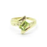 A 9ct gold, peridot and diamond ring, 1.