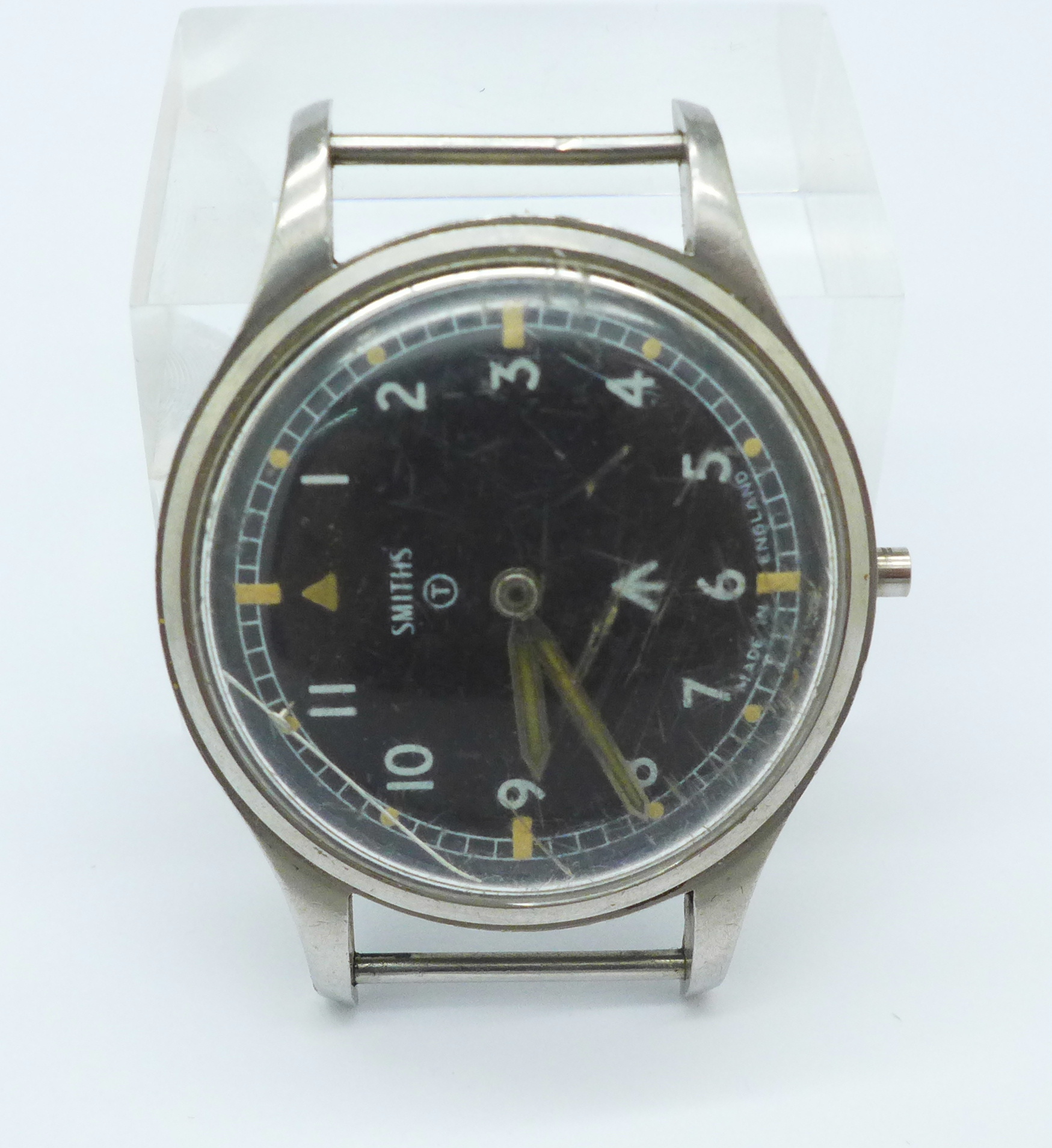 A Smiths military issue wristwatch, lacking stem and crown,