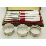 Six silver handled butter knives,