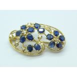 A white stone and sapphire brooch, 6.