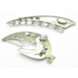 A hallmarked Scottish silver brooch and a similar unmarked sword shaped brooch,