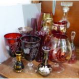 A collection of ruby glass including an etched glass brandy and two wines and other glass