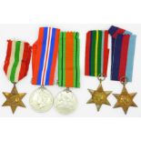 A group of WWII medals and stars, including Pacific and Italy stars,