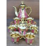 A continental pink and gilt decorated coffee service