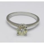 A platinum set diamond solitaire ring, 3.