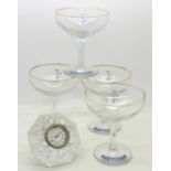 A Waterford crystal clock and four Babycham glasses
